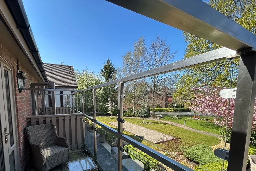 Balcony construction in Christchurch with glass railings designed by Fence Builders Christchurch.