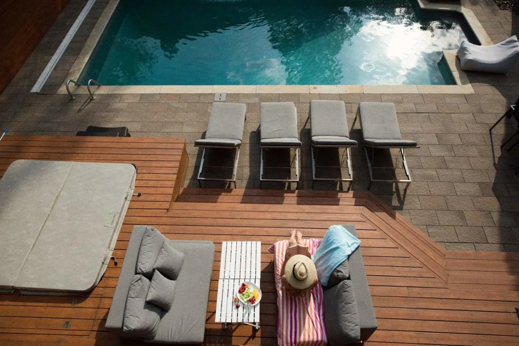 Timber poolside deck built by Deck Builders Christchurch with expert service from Fence Builders Christchurch.